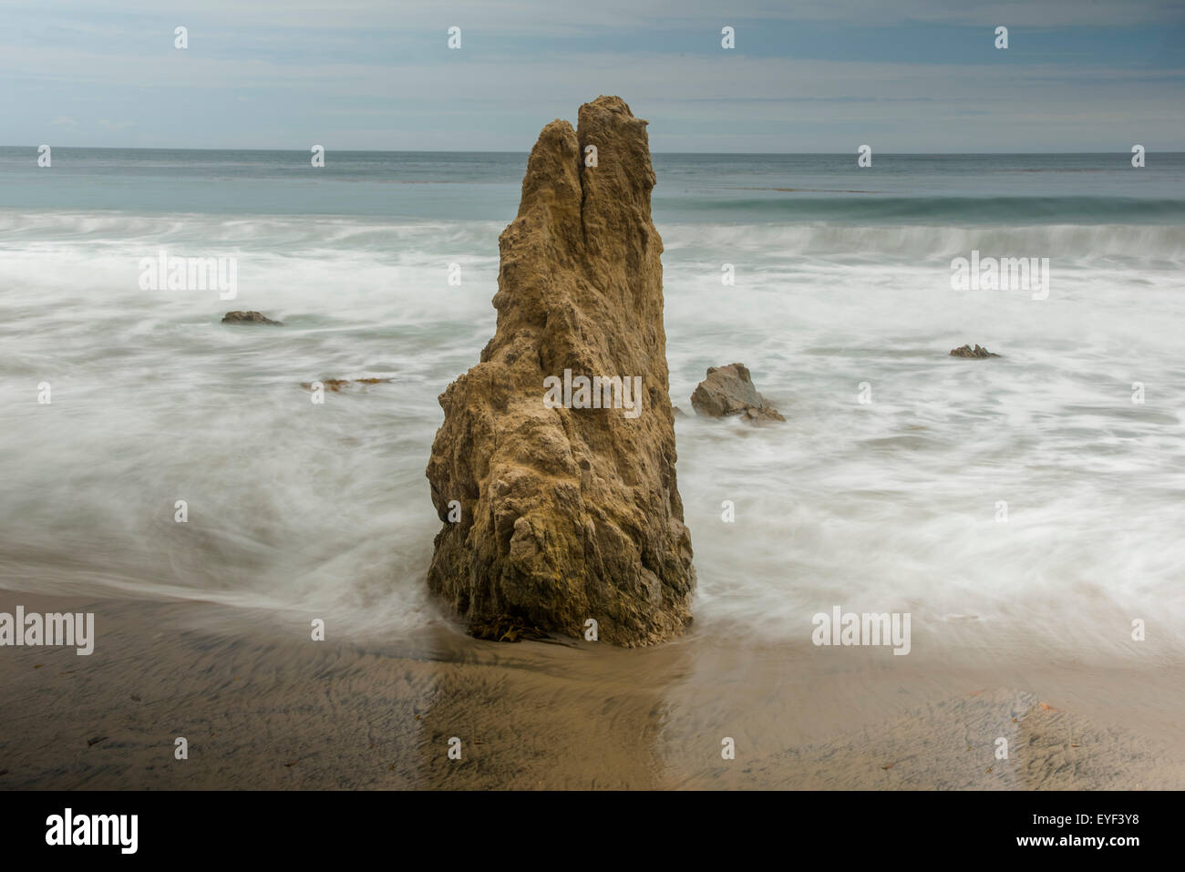A lone monolith stands sentry over Matador Beach, Malibu, CA Stock Photo