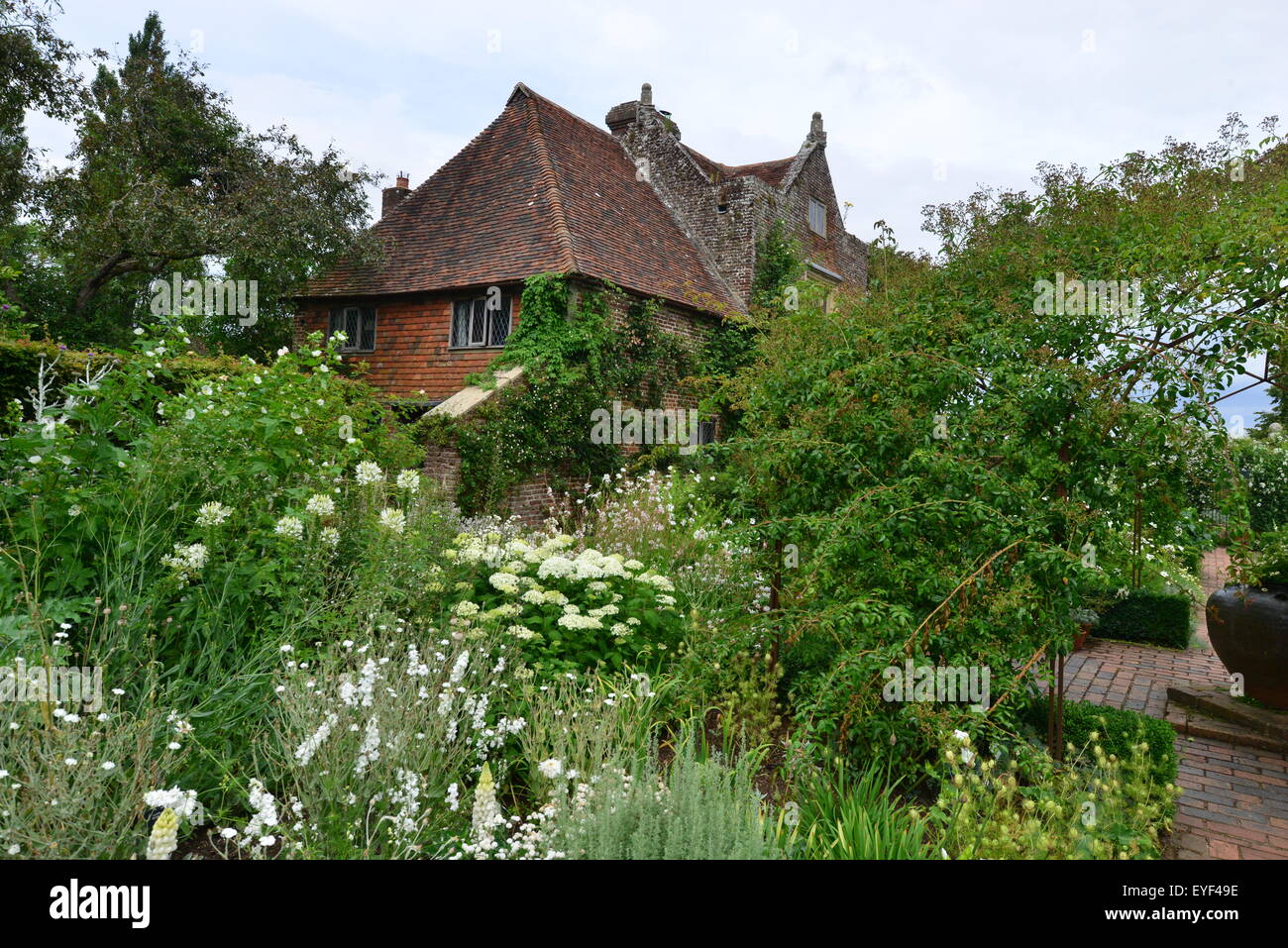 A well stocked overgrown garden in England Stock Photo