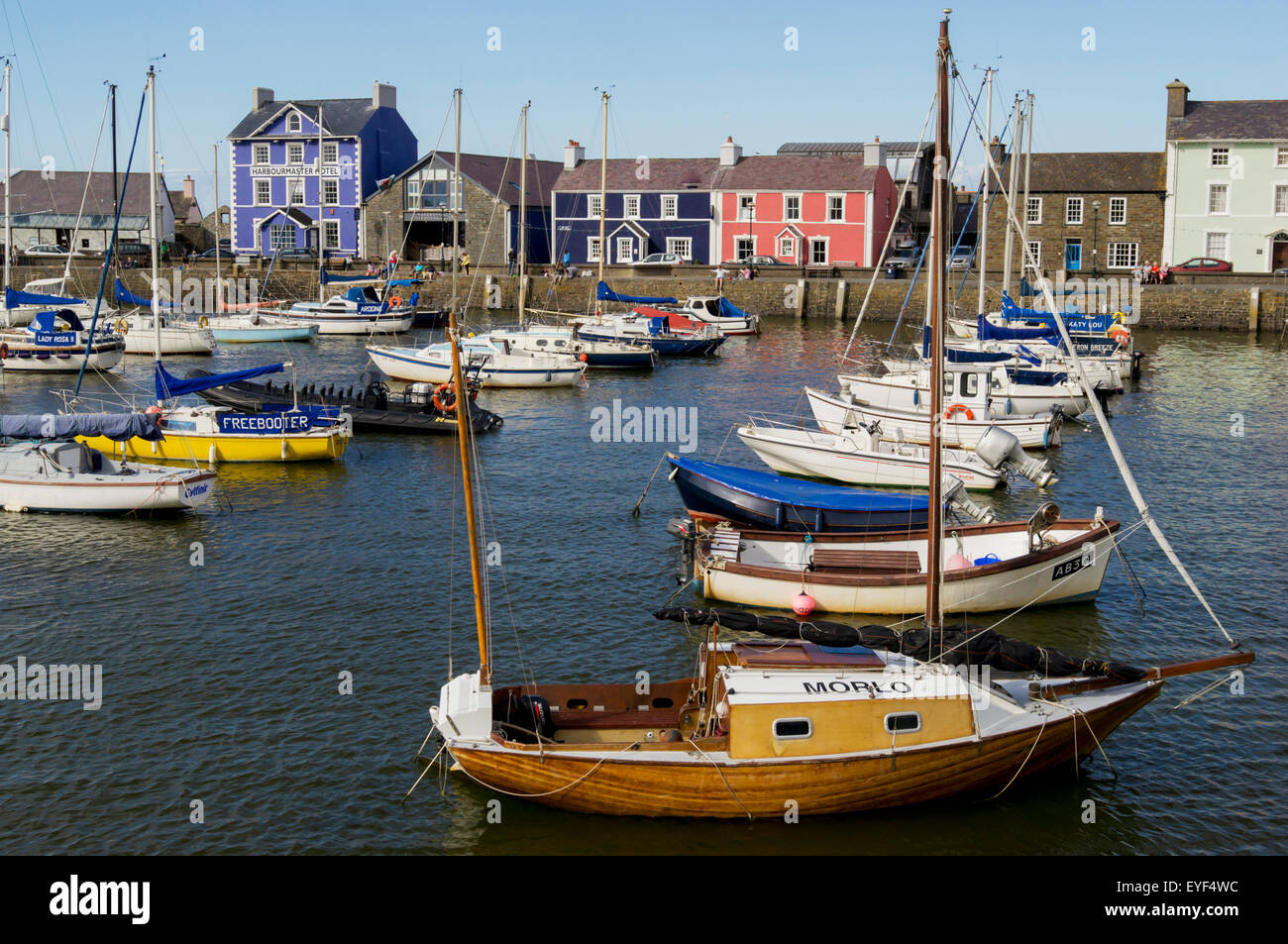 Boats and colourful houses in the Aberaeron port; Aberaeron, Ceredigion