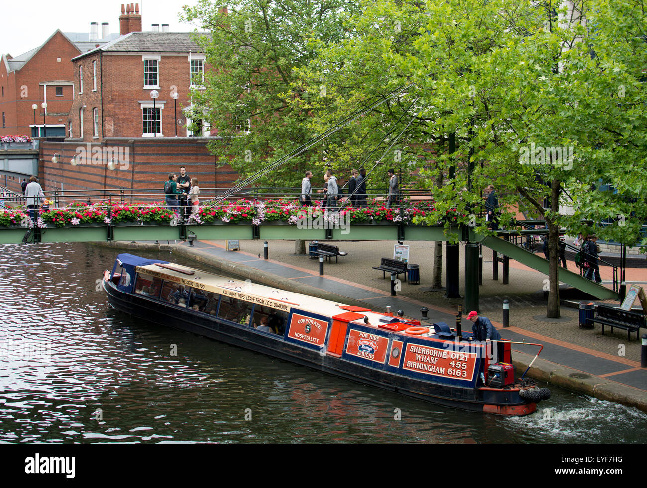 A trip narrowboat on the Birmingham Canal Old Line, Brindley Place, Birmingham, UK Stock Photo