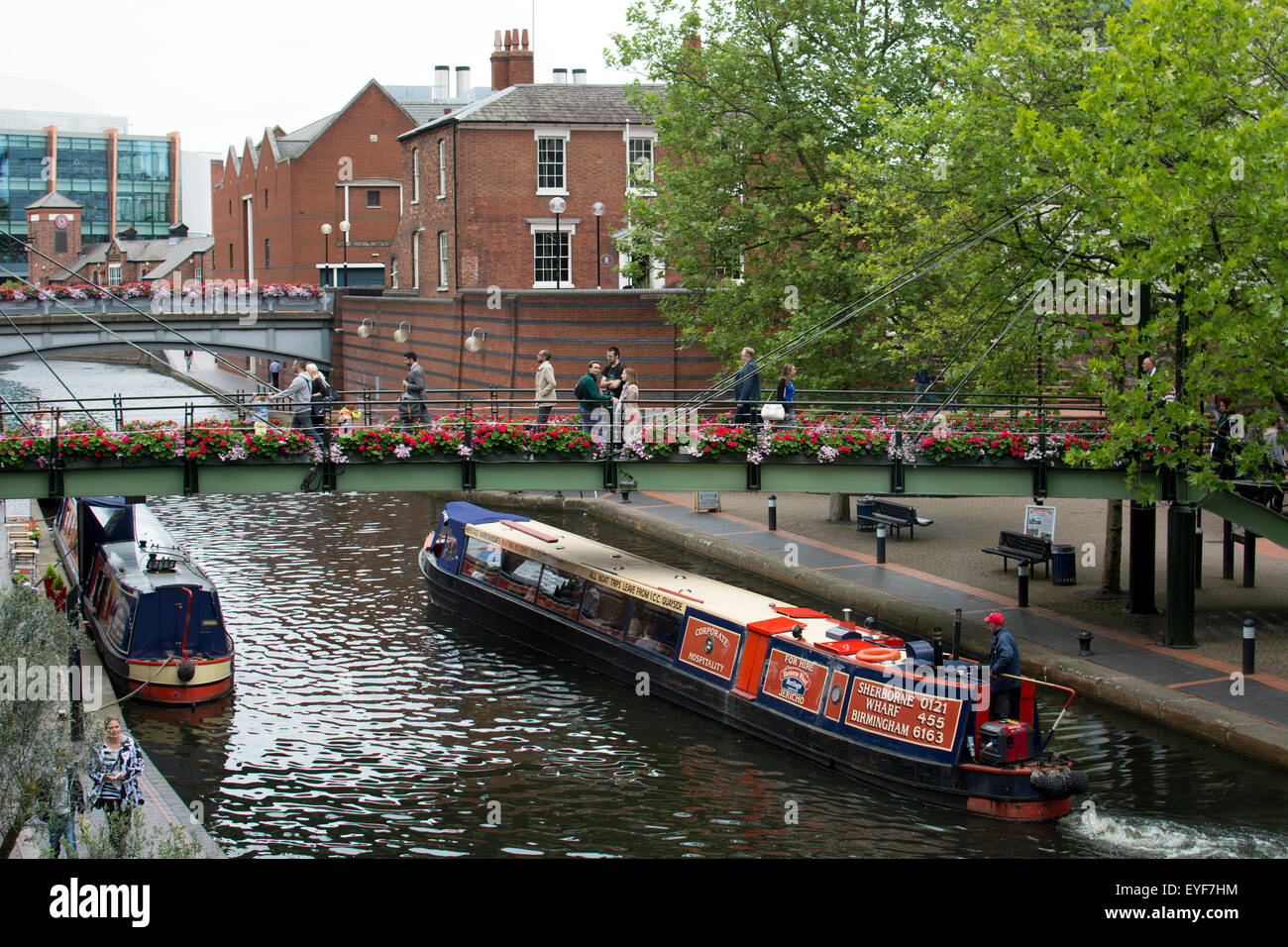 A trip narrowboat on the Birmingham Canal Old Line, Brindley Place, Birmingham, UK Stock Photo