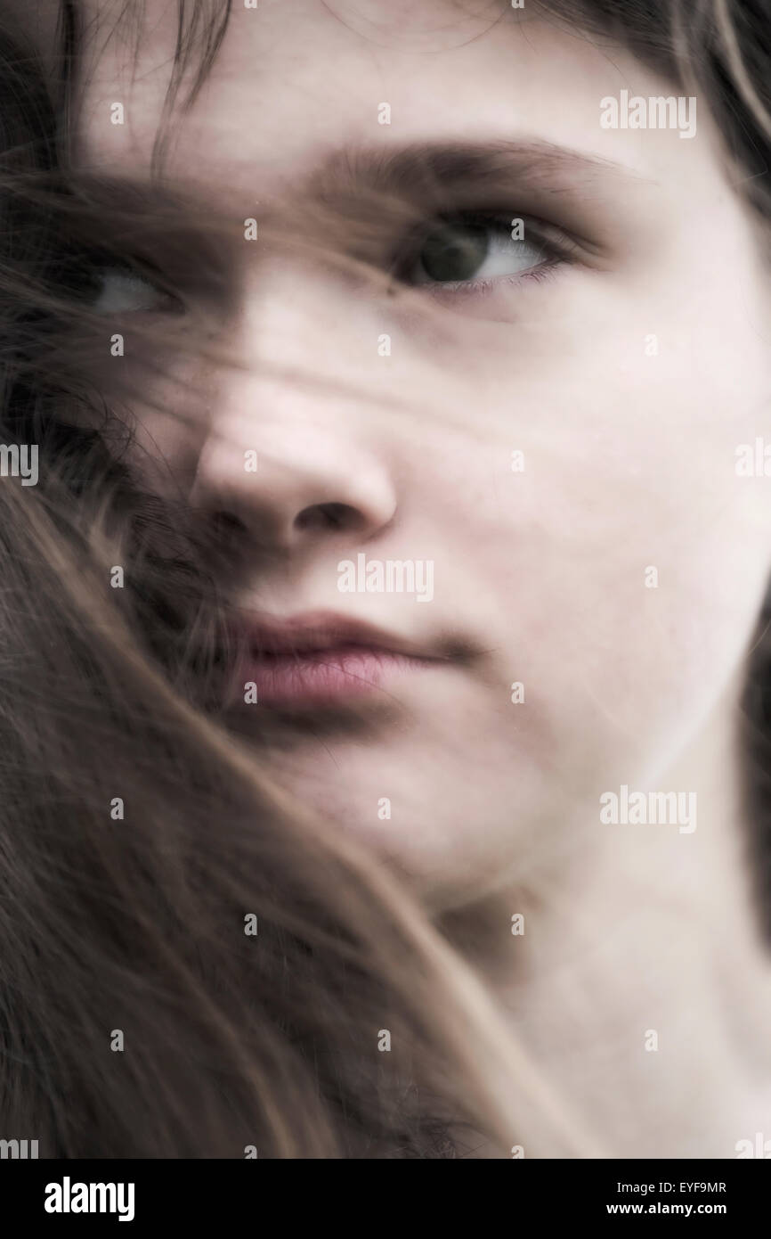 headshot of a young and sad teenage girl Stock Photo