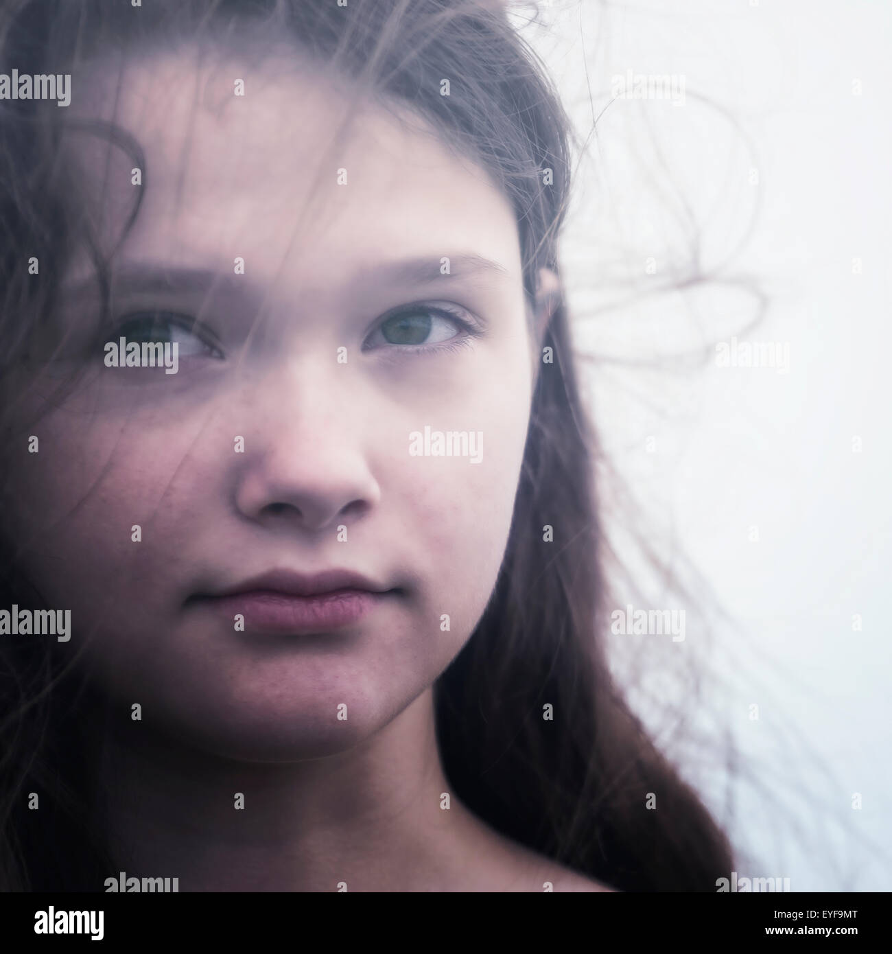 headshot of a young and sad teenage girl Stock Photo