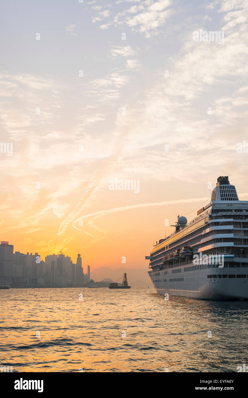 Cruise ship in the harbour at sunset, Kowloon; Hong Kong, China Stock Photo