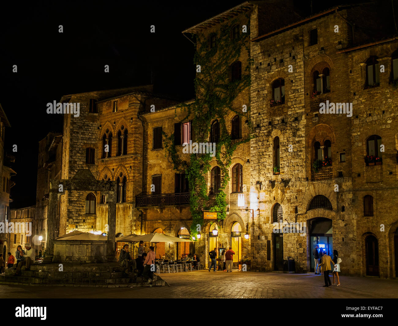 A nighttime view of the piazza in San Gimingano, a small walled Tuscan town in Italy; San Gimignano, Siena, Italy Stock Photo