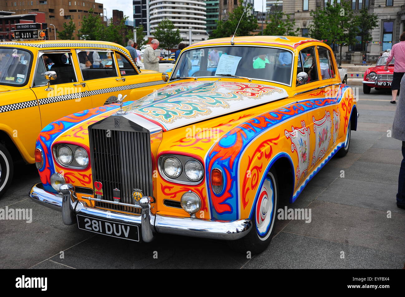 Rolls Royce with psychedelic paint scheme on show at Liverpool's Pier Head. Stock Photo