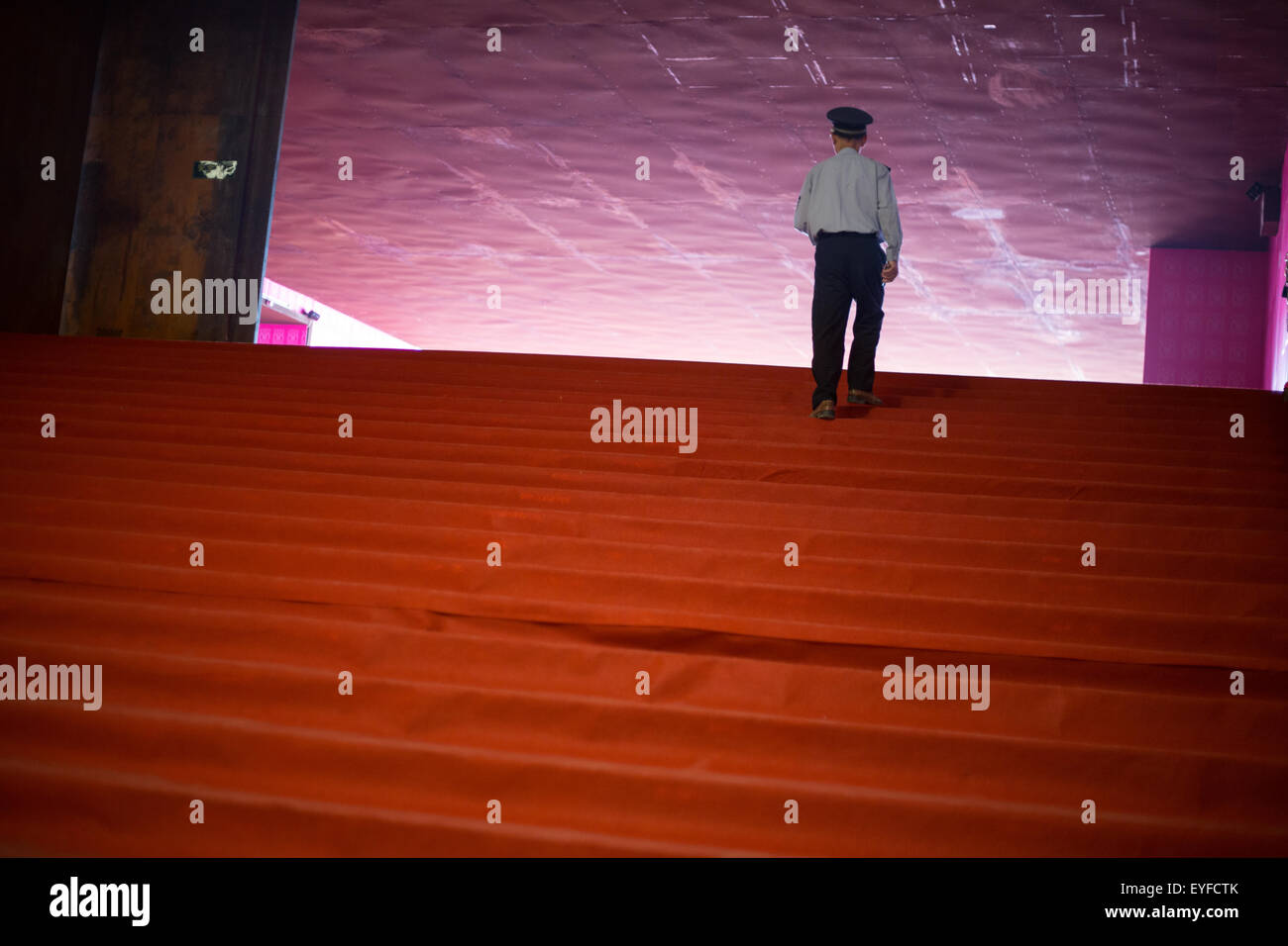 Security guard ascends stairs in a gallery, Songzhuang Art District, in Beijing, China Stock Photo