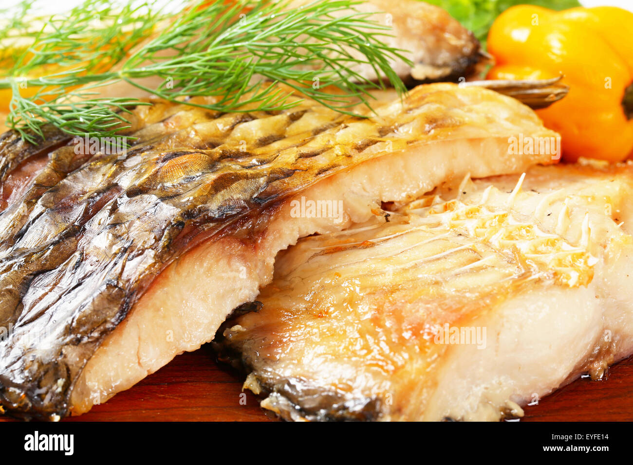 Oven baked carp fillets with dill Stock Photo