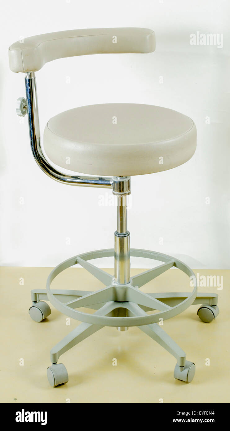 A dental assistant's chair provides support and balance while leaning
