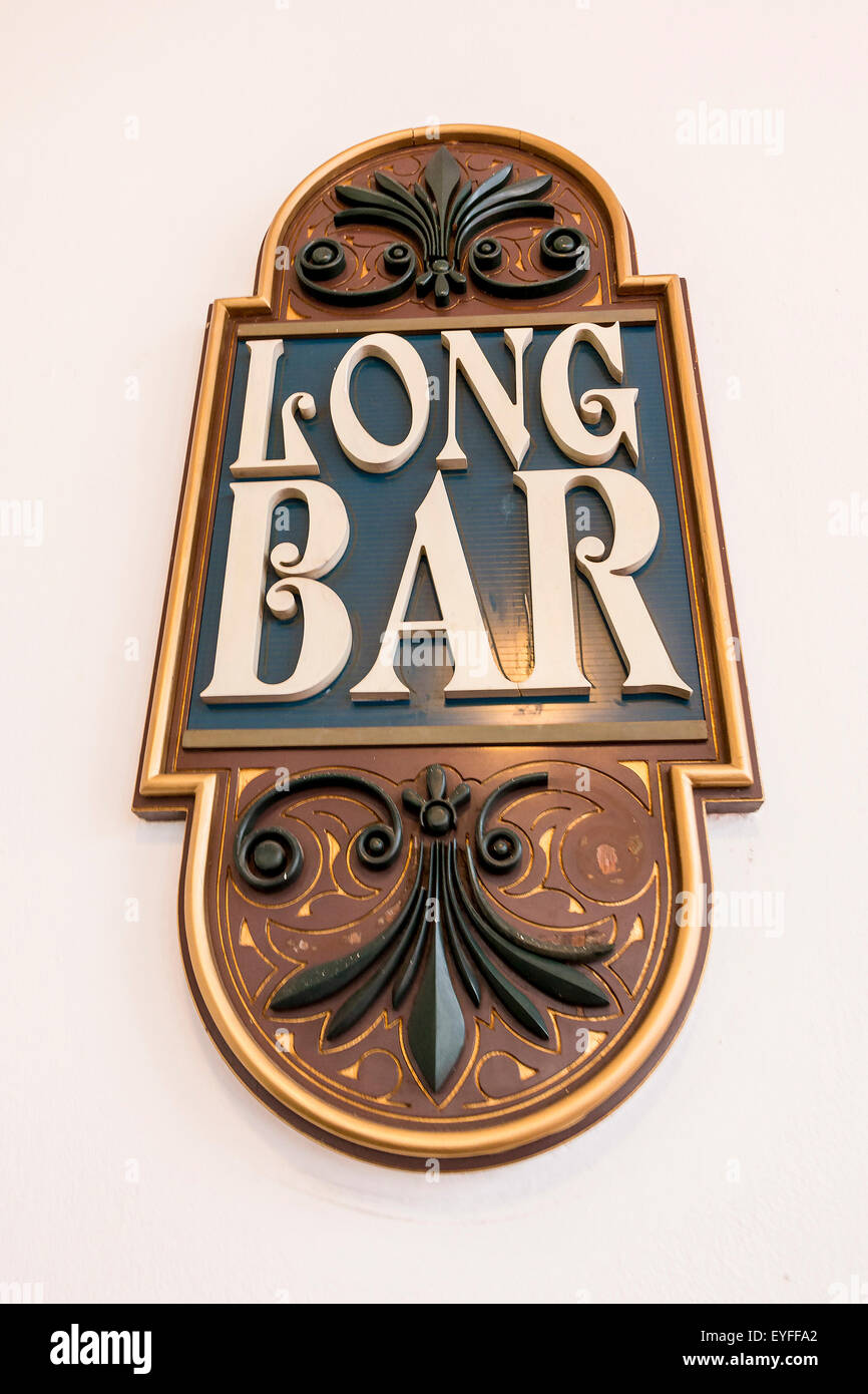 Sign for the iconic Long Bar at Raffles Hotel  where Singapore Sling drinks are served to tourists. Stock Photo