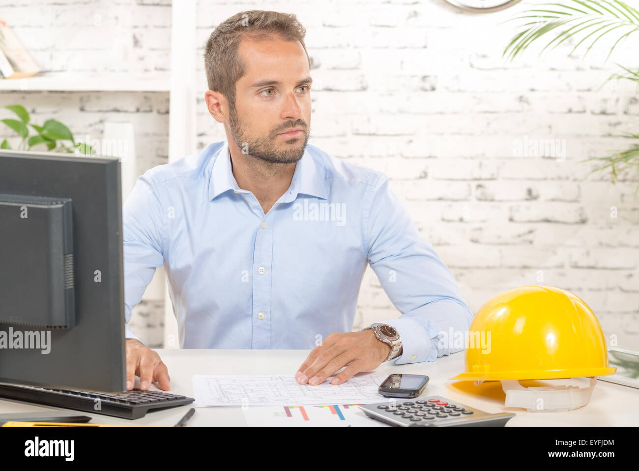 young engineer working on his computer in his office Stock Photo - Alamy