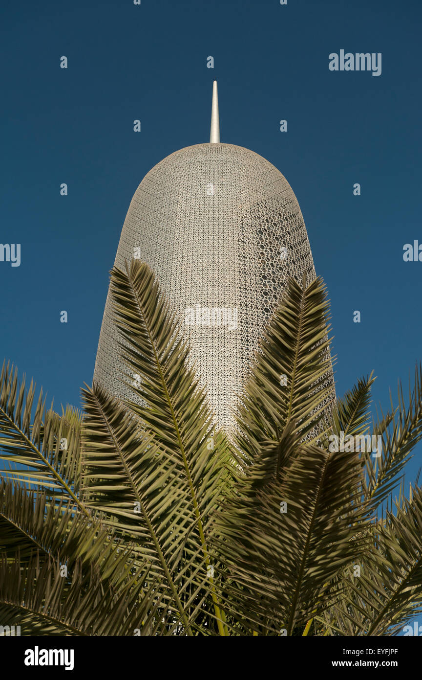 New office building behind date palm; Doha, Qatar Stock Photo
