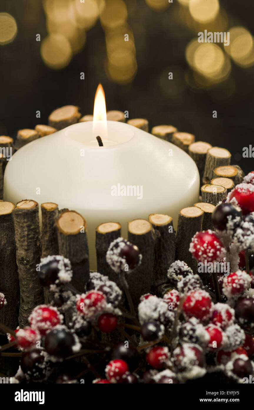Autumn decorated candles in front of a gold background Stock Photo