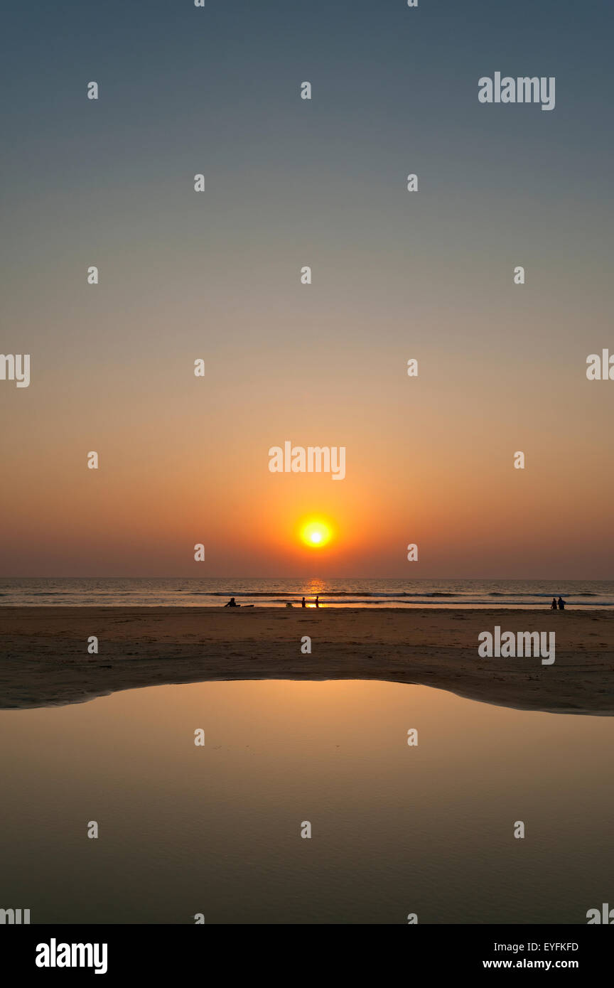 Calm pool of water at dusk on beach; Goa, India Stock Photo - Alamy