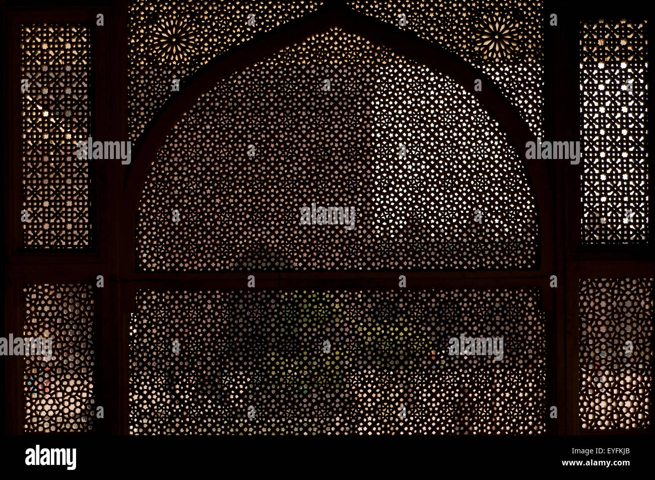 Looking through stone lattice wall in the Jami Masjid; Fatehpur Sikri, Agra, India Stock Photo