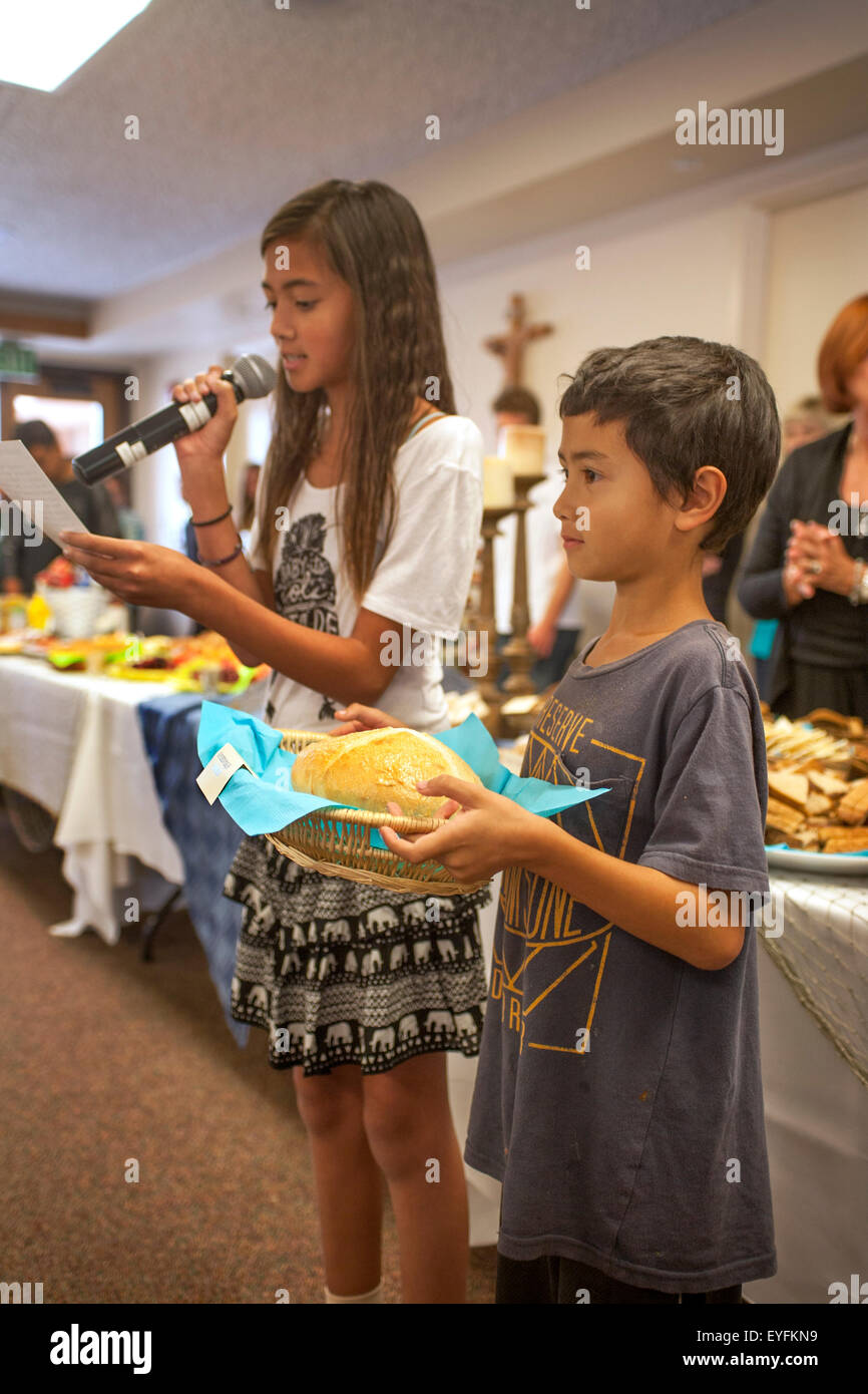 At a Laguna Niguel, CA, Catholic church bread in a baskets symbolizes the congregation's unity with all people and God in preparation for First Communion, also known as Holy Eucharist. Stock Photo