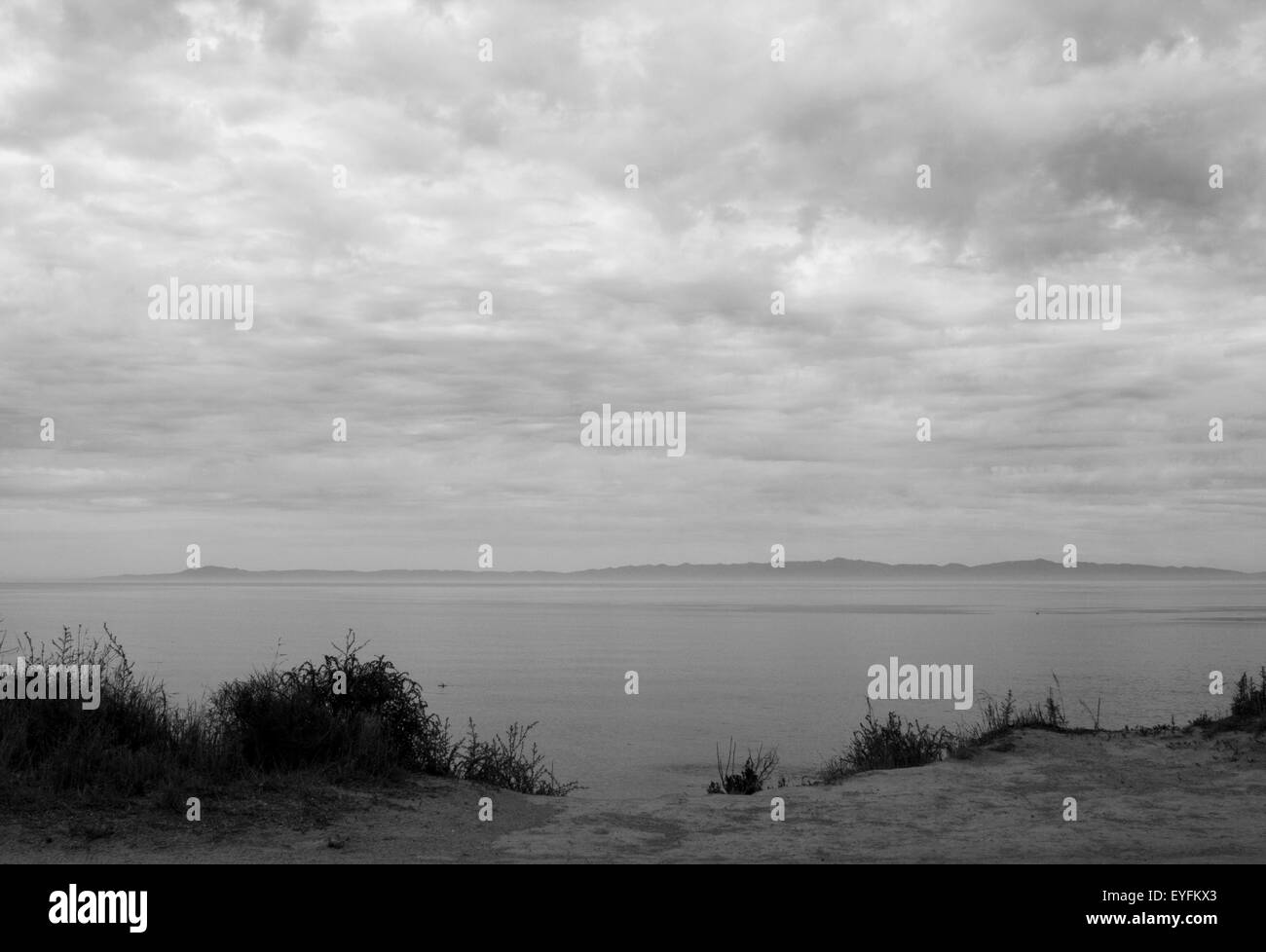 view of Santa Cruz Island off the coast of Santa Barbara on a cloudy day - black and white Stock Photo