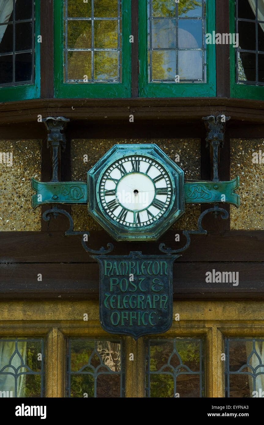 Old post office clock and sign in Upper Hambleton Village, near Rutland