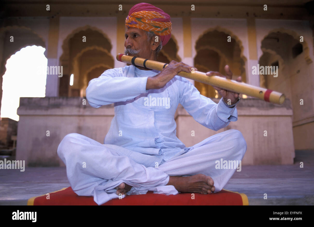 Indian man playing the flute hires stock photography and images Alamy