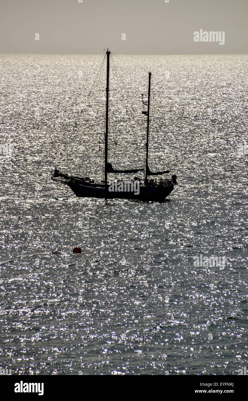 Silhouette Boat in the Ocean Stock Photo - Alamy
