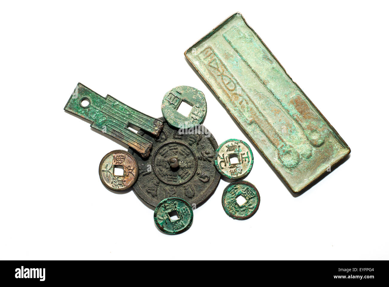 Many Ancient Chinese bronze coins on a white background Stock Photo
