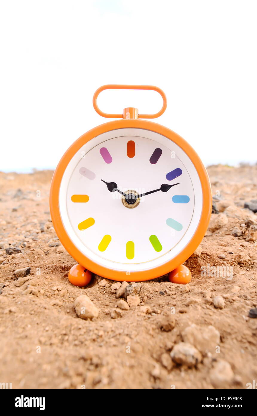 Classic Analog Clock In The Sand Stock Photo Alamy