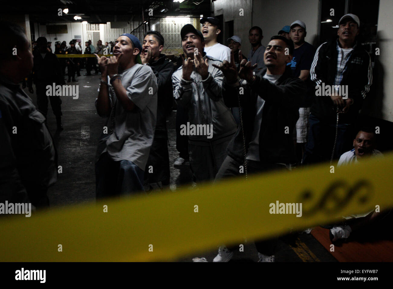 Ciudad De Guatemala, Guatemala. 28th July, 2015. A group of suspected gang members are kept in the lockup of the Tower of Courts in Guatemala City, capital of Guatemala, on July 28, 2015. According to local press, three suspected members of criminal gang Mara Salvatrucha were shot during a fight that occurred in a lockup that is located in the basement of the Tower of Courts. © Stringer/Xinhua/Alamy Live News Stock Photo