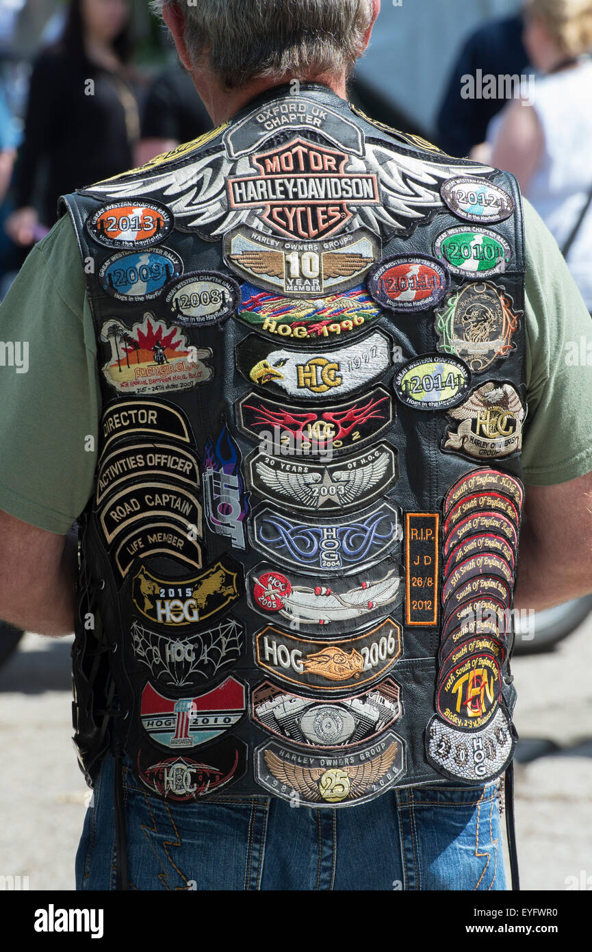 Biker wearing a leather waiscoat covered in badges. England Stock Photo