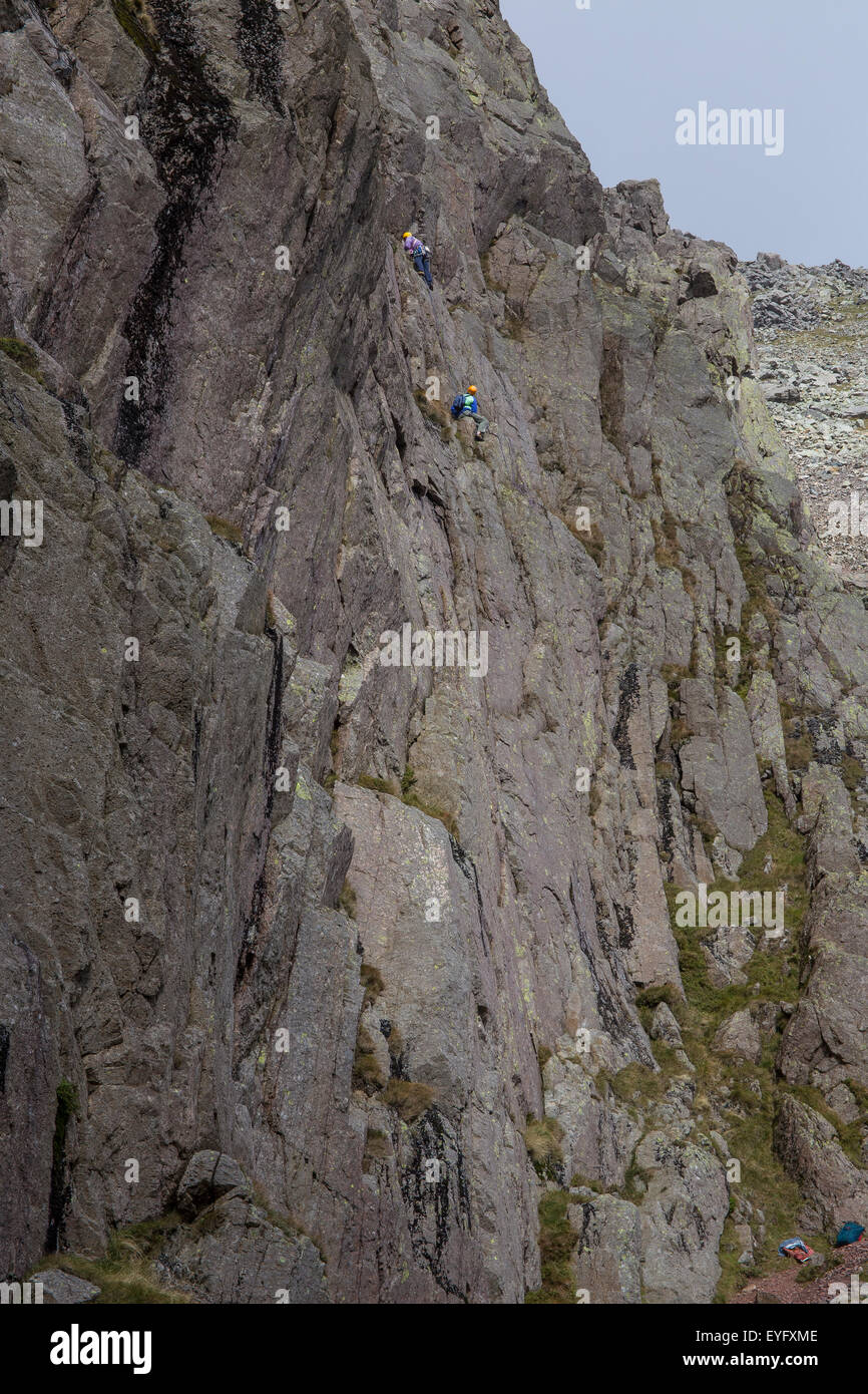 Rock climbers on Great Gable, in the Lake District UK climbing on the