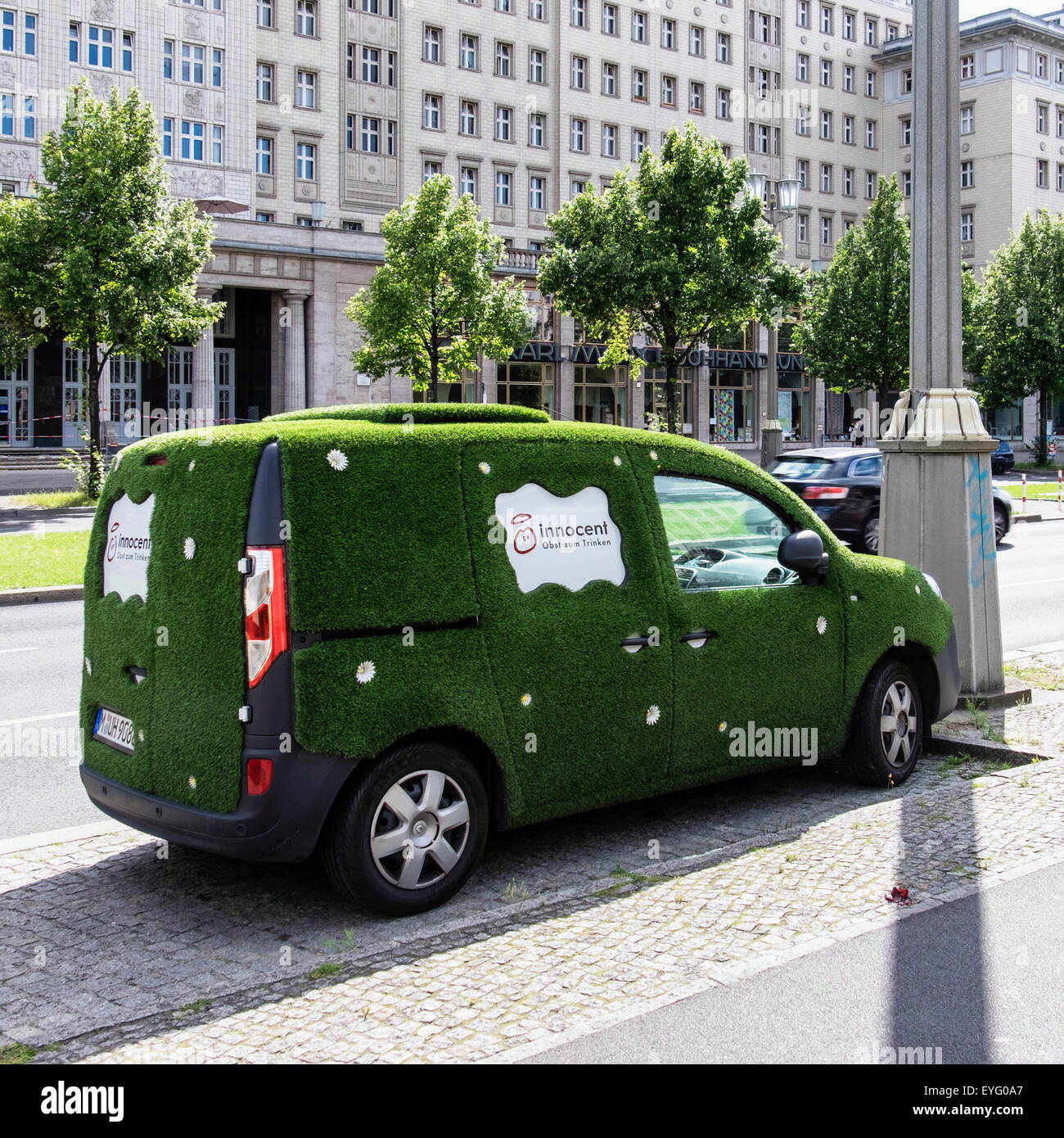 Green Delivery Van parked, vehicle covered in grass and daisies delivers  Innocent juices Stock Photo - Alamy