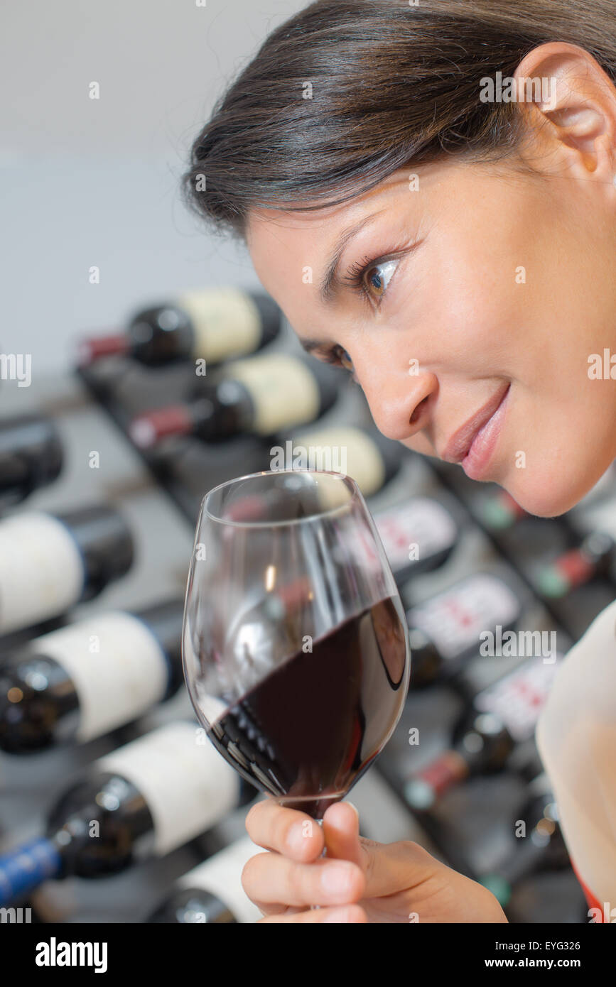 Lady holding glass of red wine Stock Photo - Alamy