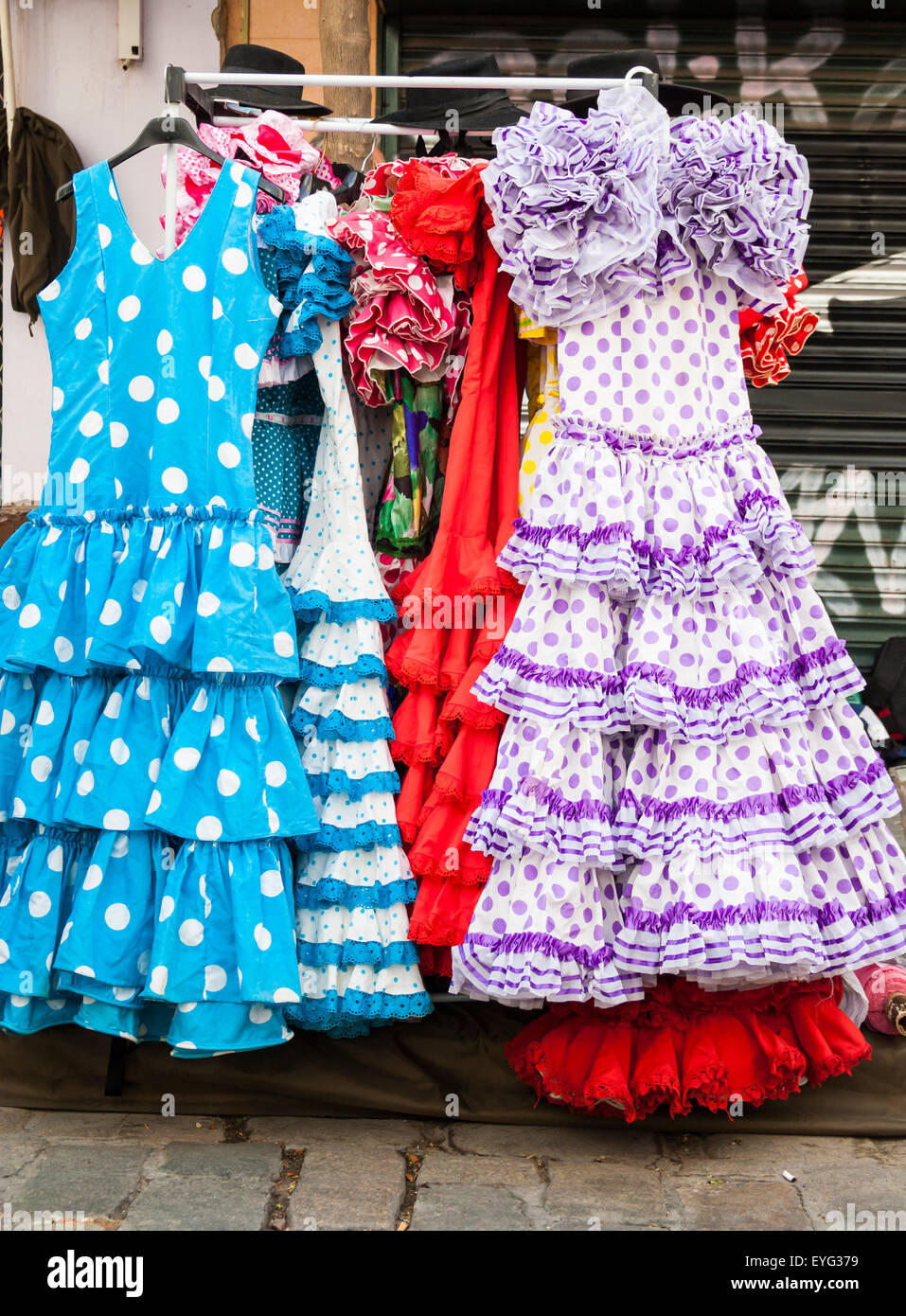 Secondhand Flamenco dresses on famous street Flea market in Calle Feria in  Seville, Spain Stock Photo - Alamy