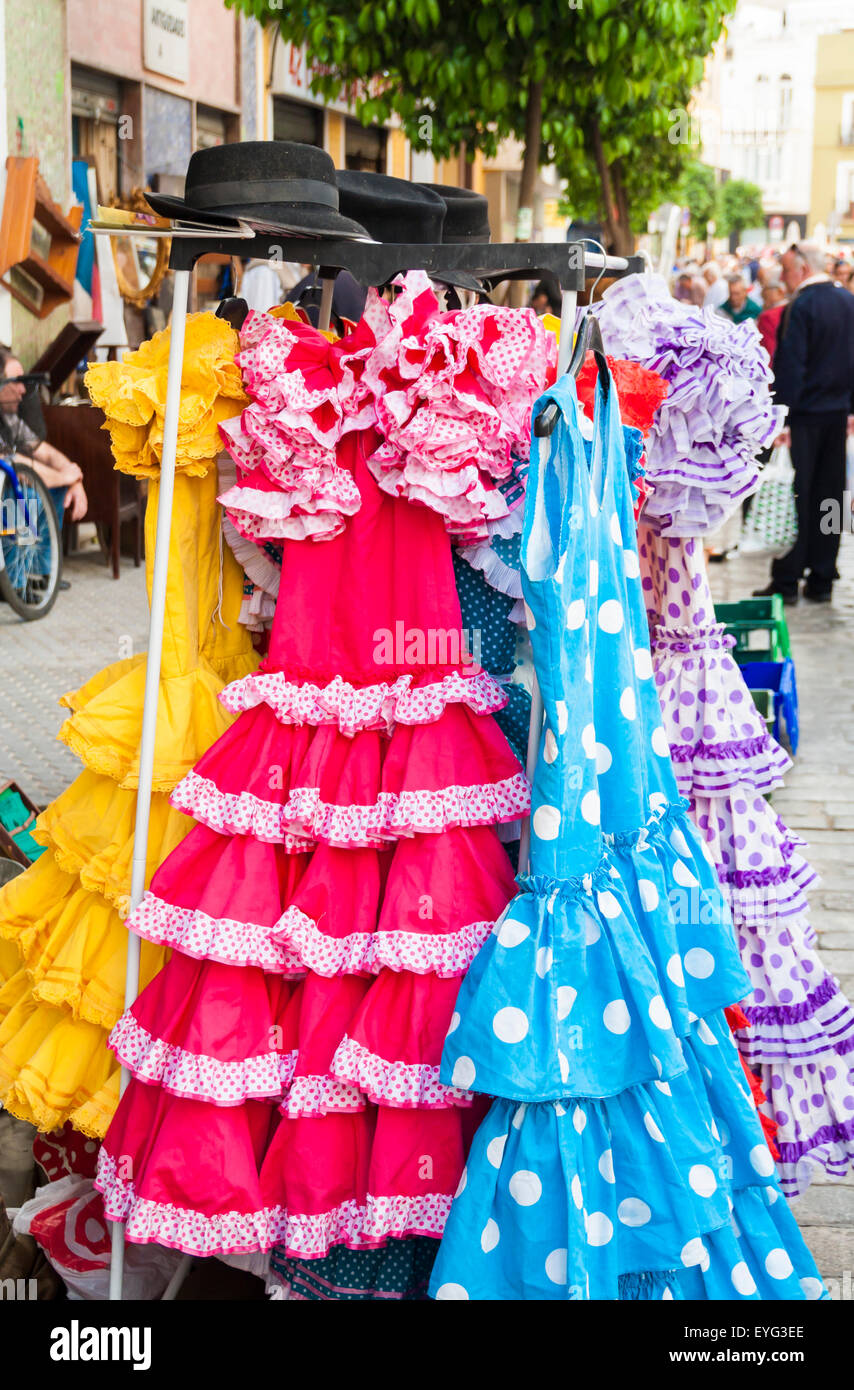 Secondhand Flamenco dresses on famous street Flea market in Calle Feria in Seville, Spain Stock Photo