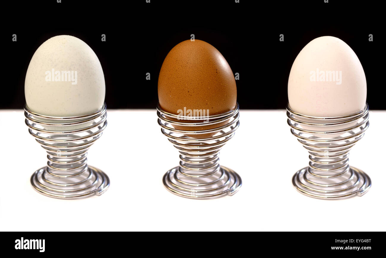 Three eggs in springy cups Stock Photo