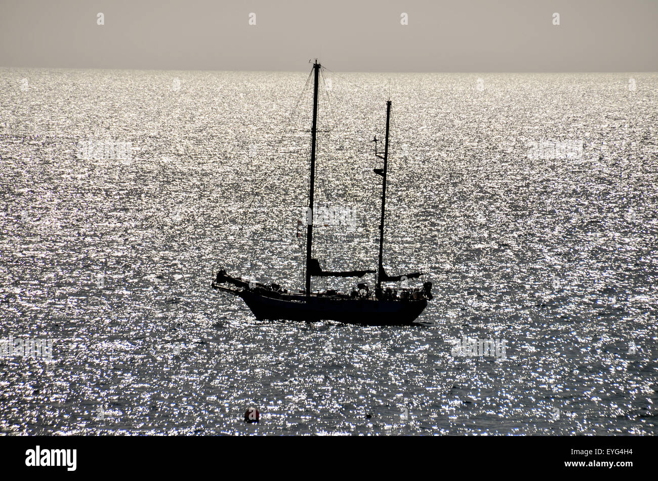 Silhouette Boat in the Ocean Stock Photo - Alamy