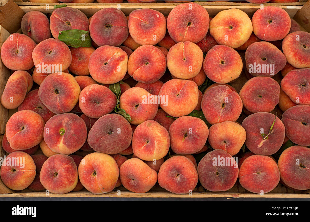 Fresh ripe saturn peaches in a market Stock Photo Alamy