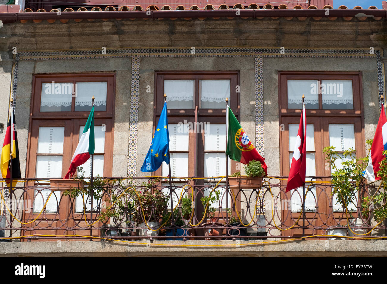 Flags in some hostel balcony, Porto, Portugal Stock Photo