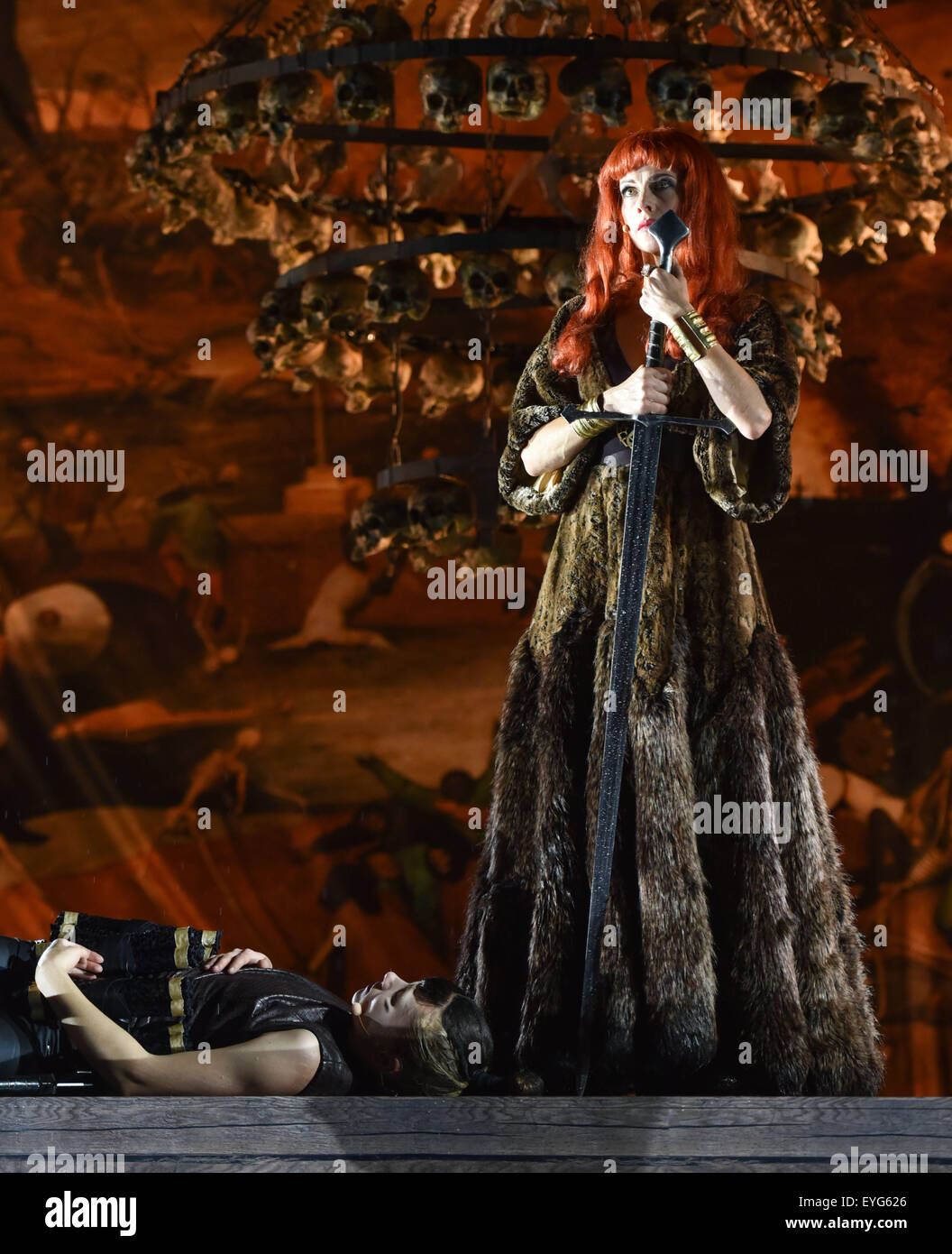 Worms, Germany. 28th July, 2015. Alina Levshin (l) as Ortlieb and Judith Rosmair als Kriemhild during a photo rehearsal of the 'Nibelungen' festival on the Open air stage in Worms, Germany, 28 July 2015. The festival features the old Norse and Germanic mythology saga of the 'Nibelungen' about the life and love, treason and tragedy of the Burgundians royal family and their legendary treasure in Worms in the fifth century. This year's festival titled 'Gemetzel' (lit: Carnage) will be held from 31 July until 16 August 2015. UWE ANSPACH/dpa/Alamy Live News Stock Photo