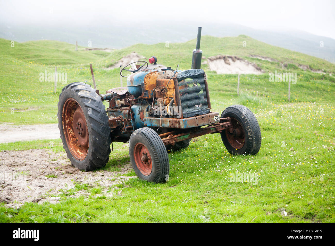 Old tractor on machair grassland, Vatersay Island, Barra, Outer Hebrides, Scotland, UK Stock Photo