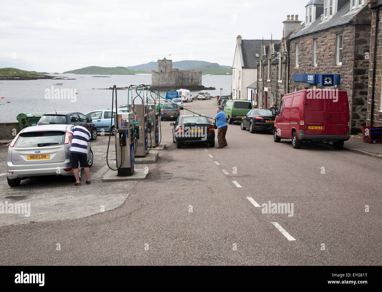Petrol pumps and shop in the main shopping street in Castlebay the largest settlement in Barra, Outer Hebrides, Scotland, UK Stock Photo