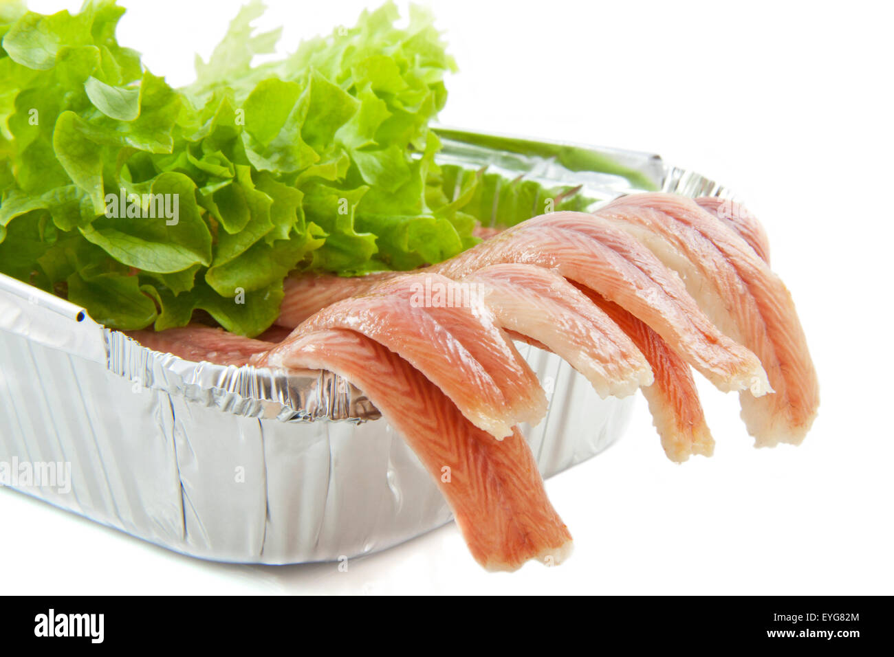 Fresh eel in aluminium box with salad over white Stock Photo Alamy