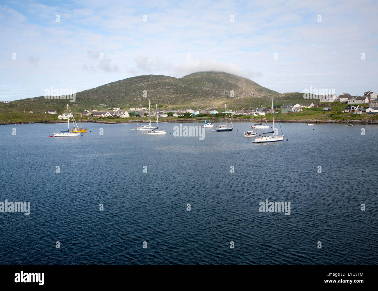 Yachts moored in the harbour at Castlebay, Barra, Outer Hebrides, Scotland, UK Stock Photo