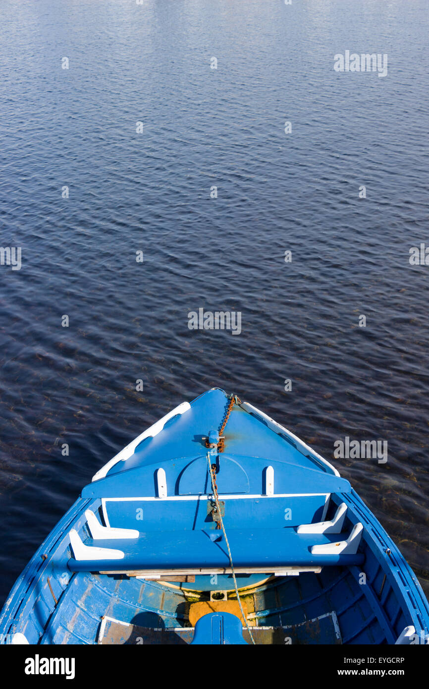 A small blue wooden fishing boat Stock Photo - Alamy