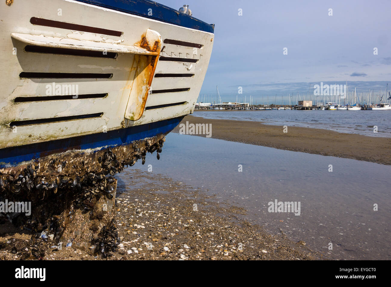 A fishing boat washed up on a beach from a recent storm in Melbourne