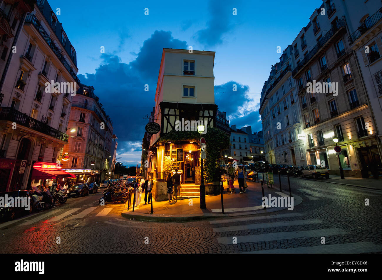 France, Montmartre; Paris, Corner restaurant at dusk Stock Photo