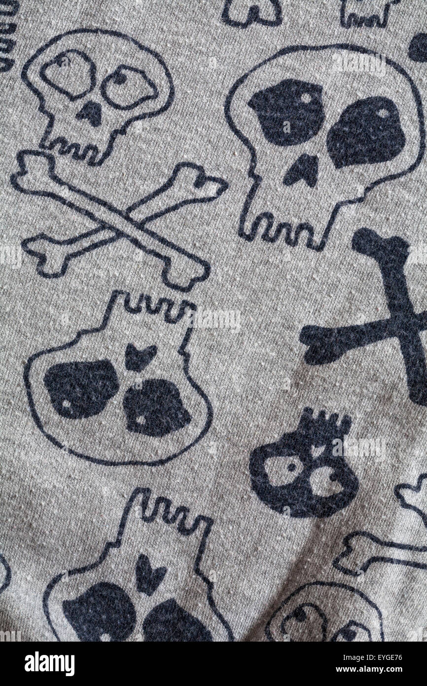 skull and cross bones detail on child's pyjamas garment Stock Photo - Alamy