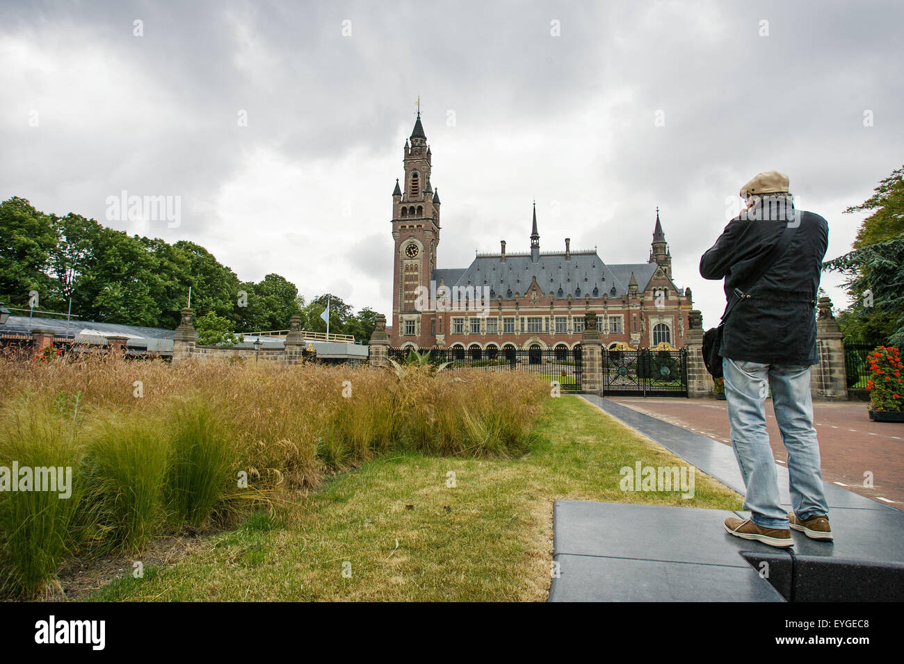 A man is seen taking a photo of the international court of justice ...