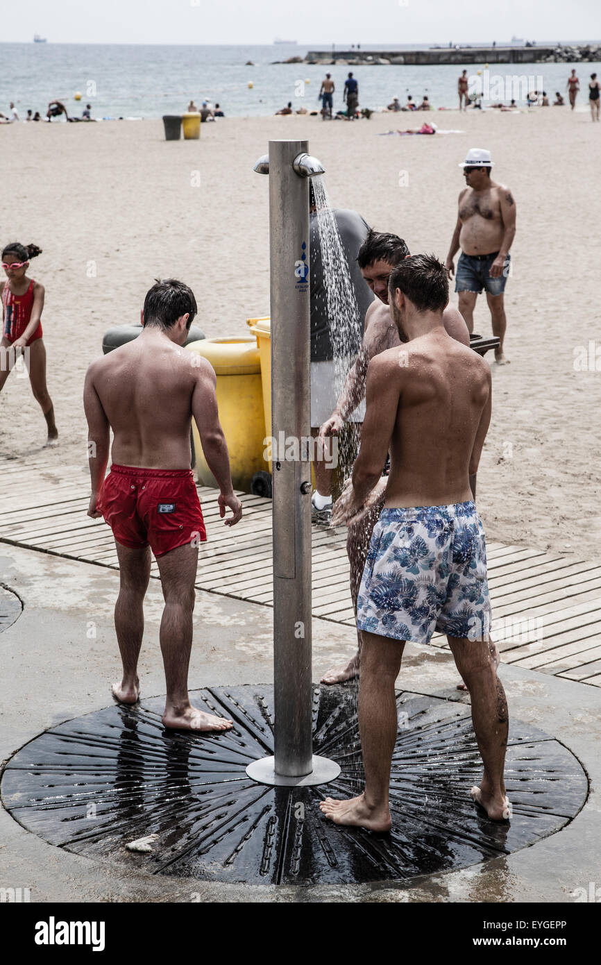 men taking a shower in the beach Stock Photo Alamy