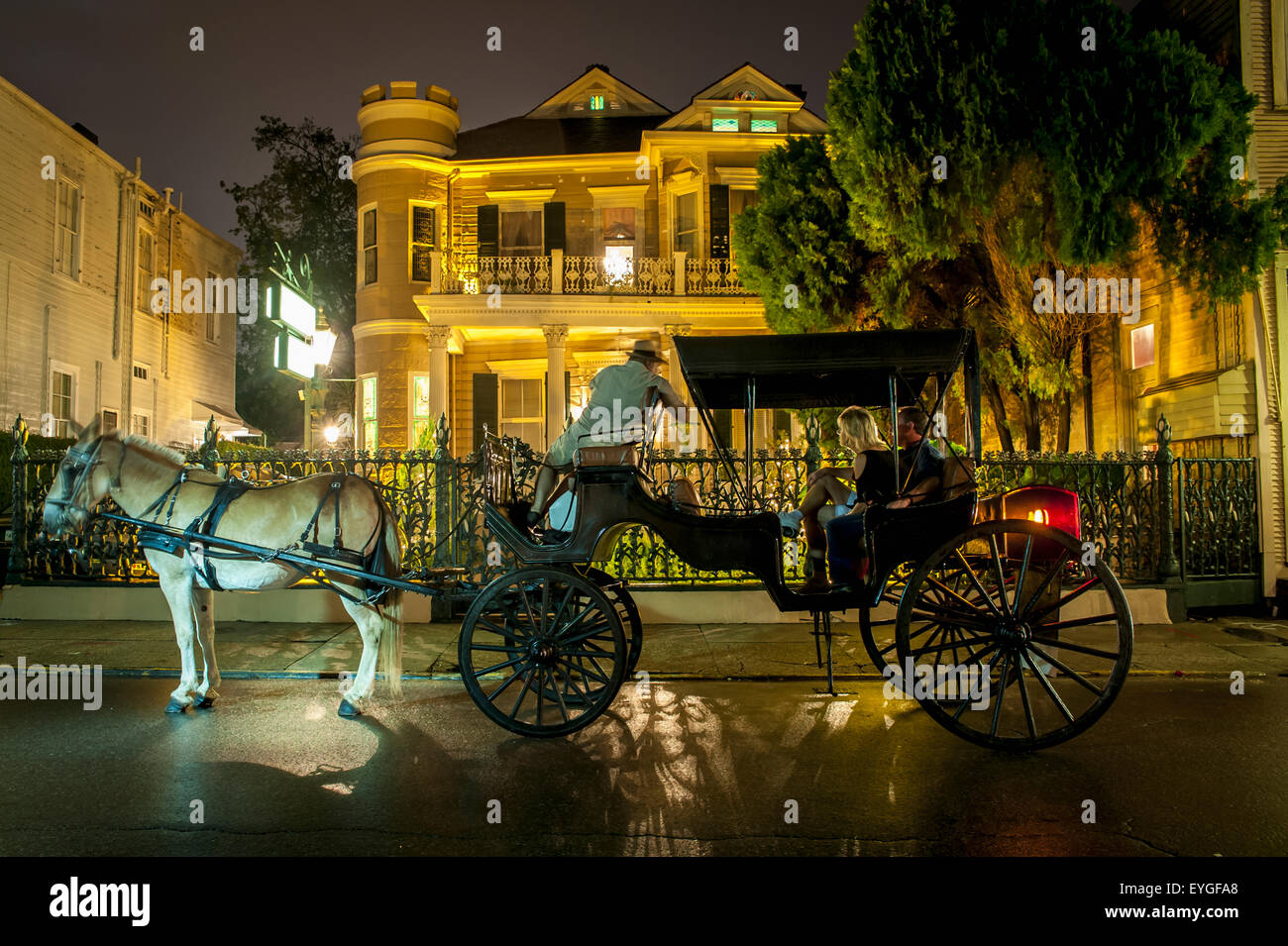 USA, Louisiana, French Quarter; New Orleans, Tourist travelling with horse carriage Stock Photo
