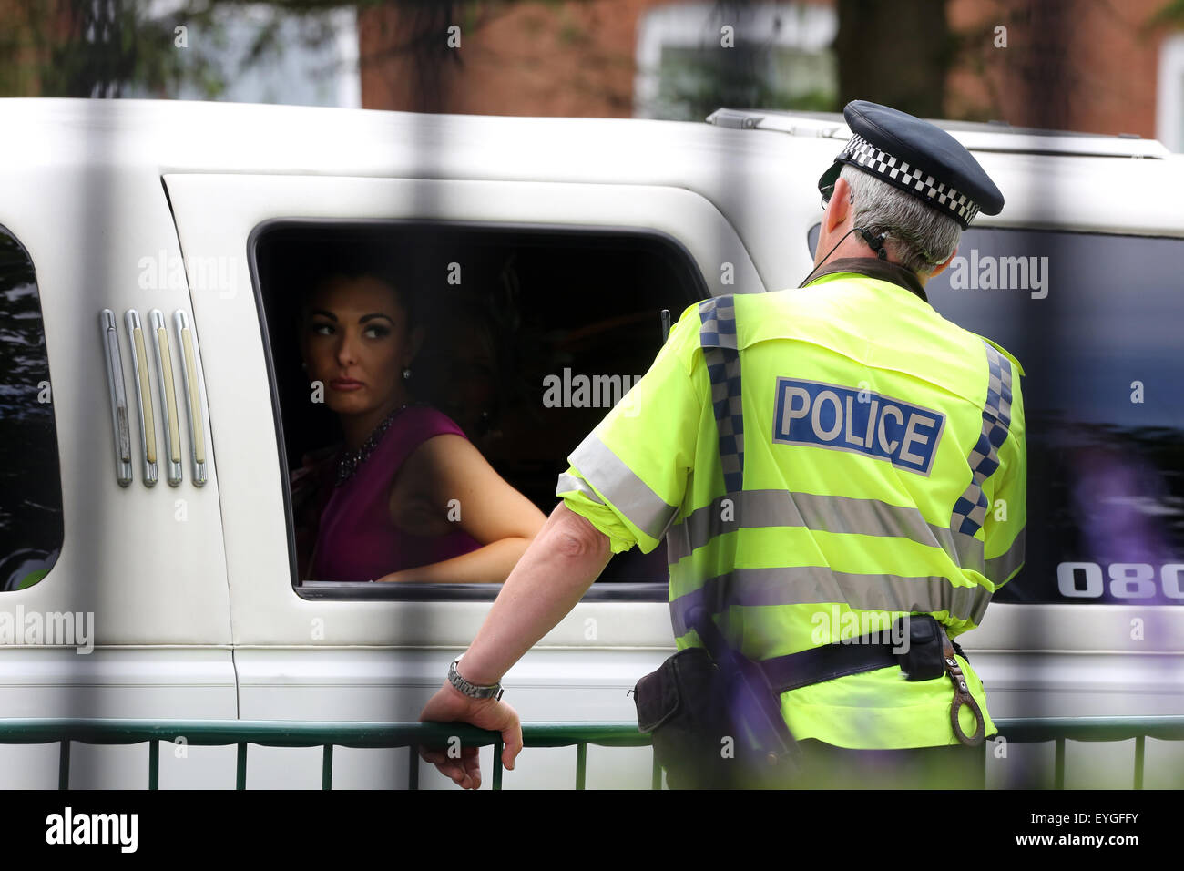 Ascot, United Kingdom, woman looking out of a car out to a policeman Stock Photo
